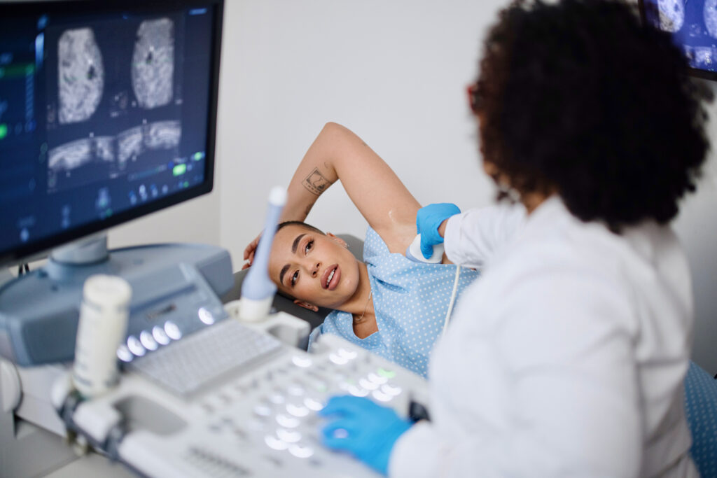 ultrasound technician with patient